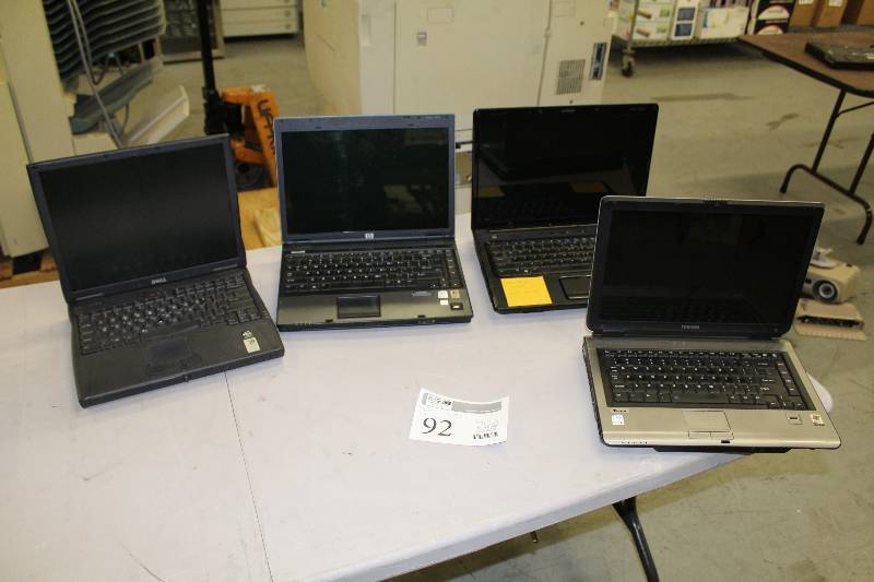 lot 92 image: Lot of (4) Laptop Computers For Parts - Dell Latitude, Compaq 6510b, Toshiba Tecra, Compaq Presario V6000