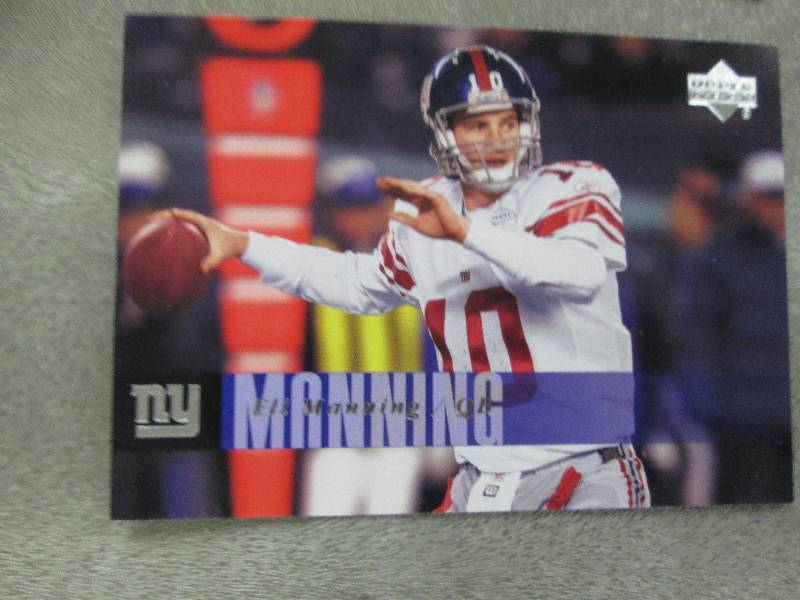 lot 84 image: Eli Manning Cards...