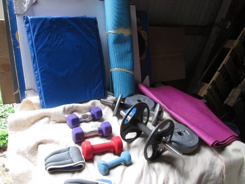 Lot of weights and exercize equipme...