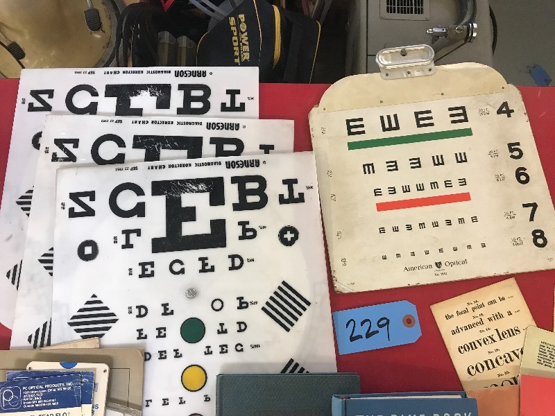 lot 229 image: OLD EYE CHARTS AND OTHER OPTOMETRY ITEMS