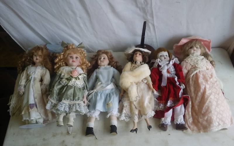 Collections Of Porcelain Dolls With Some Stands
