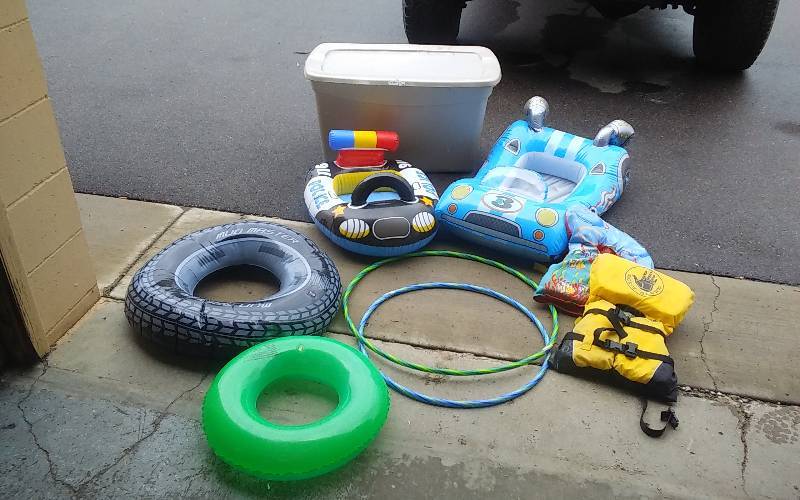 Tote Bin With Lid Full Of Inflatables