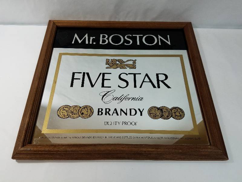 lot 7 image: Mr. Boston Five Star California Brandy Eighty Proof 18 by 19 inch Wood Frame Wall Mirror
