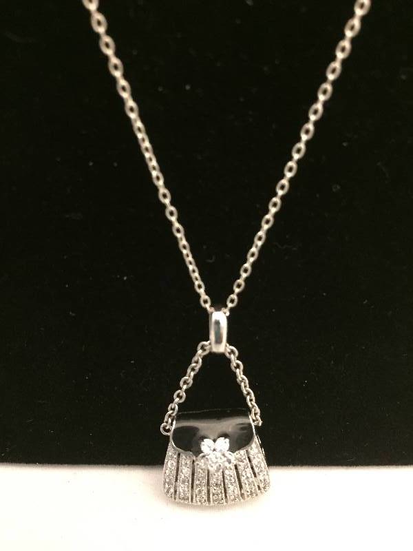 lot 553 image: Necklace - Sterling Silver Purse Pendant