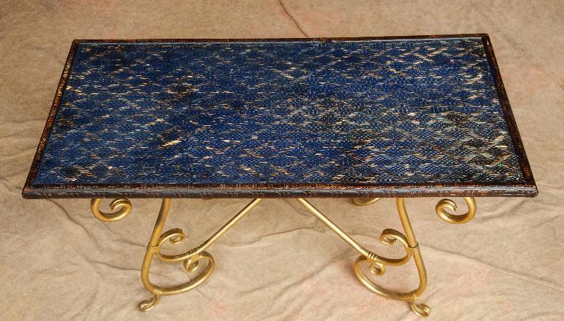 lot 14 image: Very Interesting Hollywood Regency Coffee Table with Brass Elaborately Scrolled Base & Eurasian Vogue Carved Wood & Wicker Table Top - Not Sure About That Blue Though... 