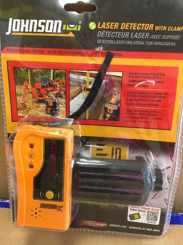 lot 58 image: Johnson Laser with clamp not used open pkg