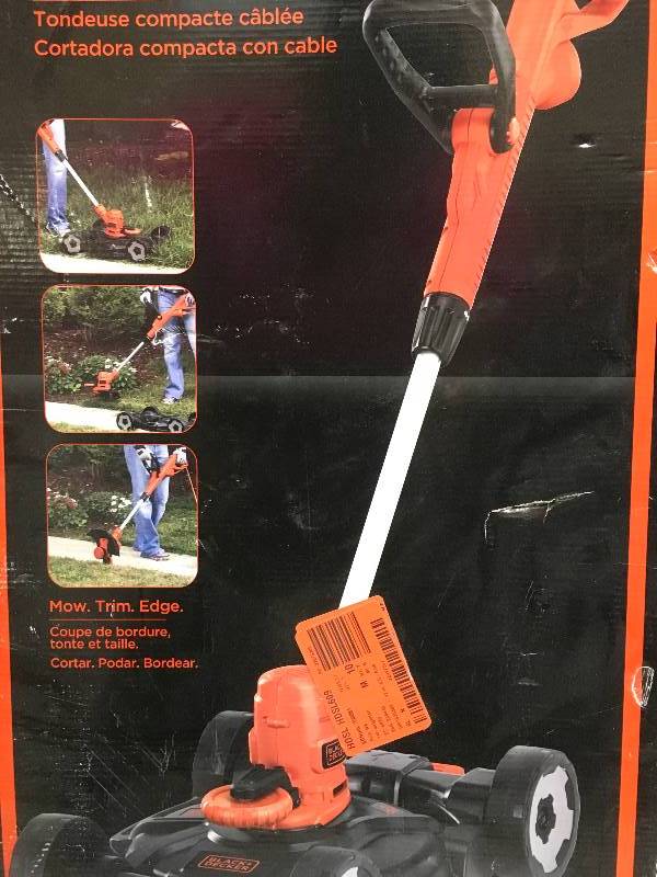 lot 69 image: Black & Decker 12 in. 6.5 Amp Corded Electric Straight Shaft Single Line 3-in-1 String Grass TrimmerLawn EdgerPush Mower Open box Tested