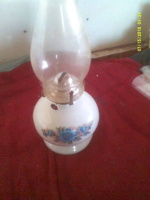 lot 69 image: COLLECTIBLE OIL LAMP