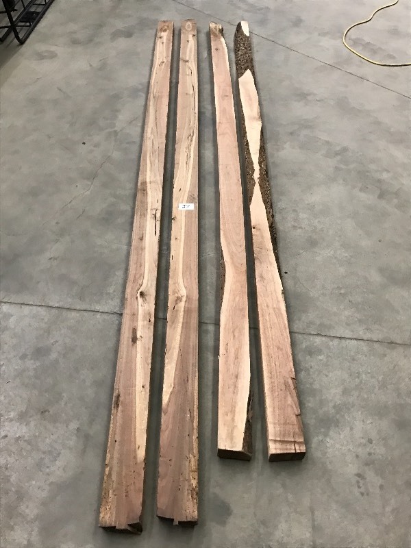 lot 25 image: (4) 2.25x4.5x10ft Rough-Cut Black...