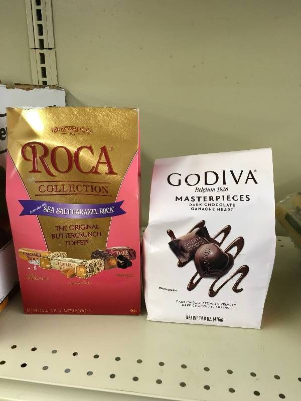 lot 11 image: ROCA COLLECTION 3VAR 28Z, RETAIL $9.79 AND GODIVA DK CHOC HEARTS, RETAIL $8.59