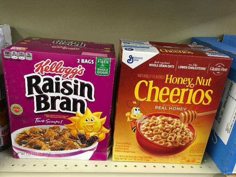 lot 21 image: HONEY NUT CHEERIOS 55 OZ, RETAIL $7.99 AND KELL RAISIN BRAN 76.5 OZ, RETAIL $8.39