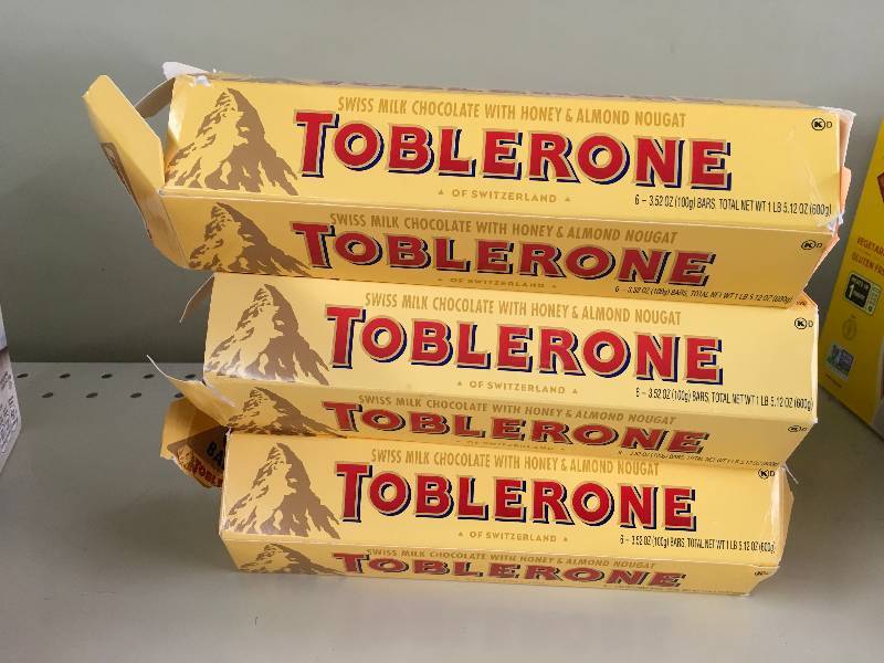 lot 25 image: THREE (3) TOBLERONE MCHOC 63.52Z, RETAIL $7.79 EACH