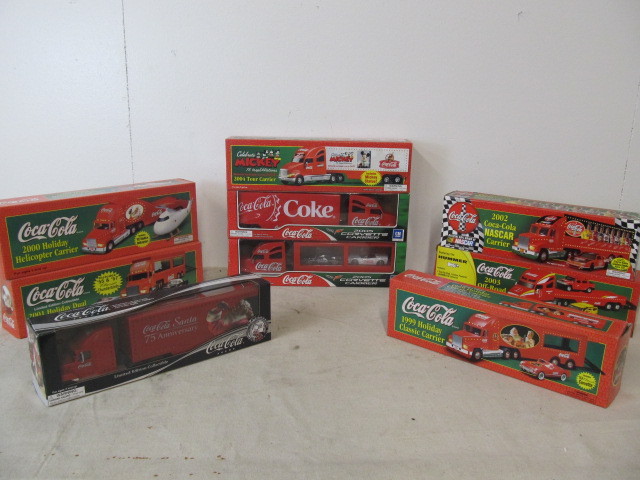 lot 34 image: Large Lot of MINT IN BOX Coca Cola Diecast Semi Trucks