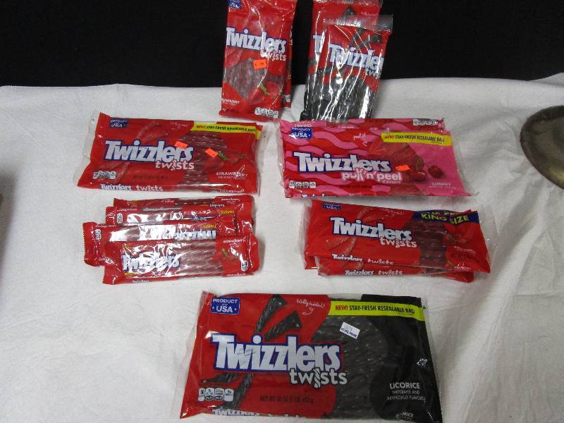 lot 37 image: 2 strawberry Twizzler Twists, 3 black Licorice Twizzler twist, 2 twizzler pulln peel cherry, 1 twizzler twists licorce . 1 twizzler twist strawberry, 3 king size strawberrry, 4 twizler strawberry