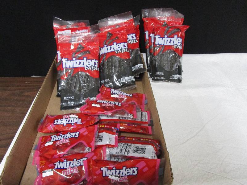 lot 51 image: 11 black licorce twizzler twists, 10 cherry twizzler nibs