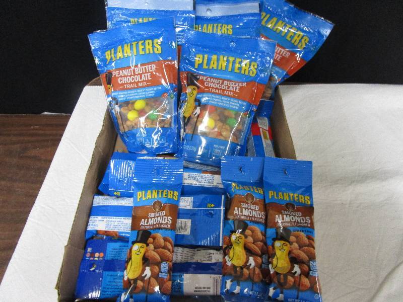 lot 52 image: 7 planters peanut butter chocolate trail mix, 14 planters smoked almonds