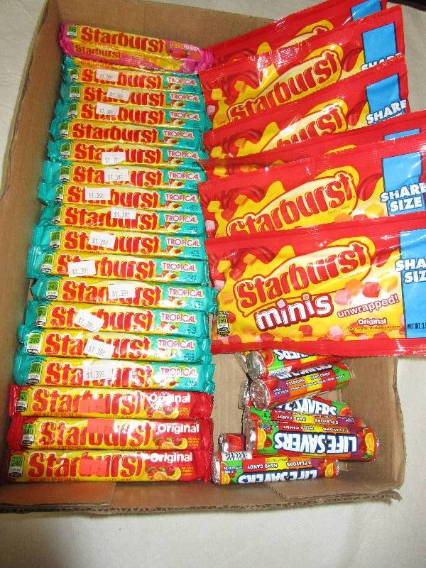 lot 61 image: 19 Packs of Regular Starburst, 6 Sharesize Bags of Starburstss, 8 Rolls of Lifesavers