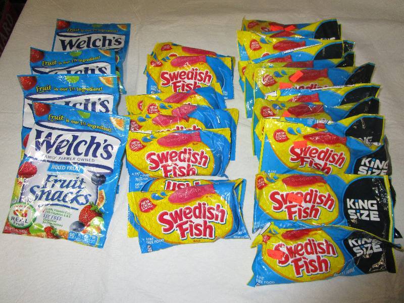 lot 68 image: 13 King Size Sweedish Fish, 8 Regular Size and 4 Bags of Welches Fruit Snacks