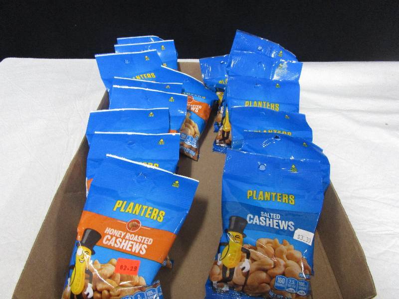 lot 81 image: 8 planters salted cashews, 9 Hoey roasted cashews.