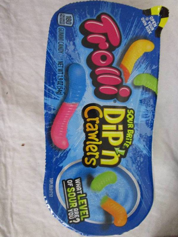 lot 92 image: 7 trolli sour bite dip n crawlers, jaw breakers, cherry slices, 4 bags of peach ringers