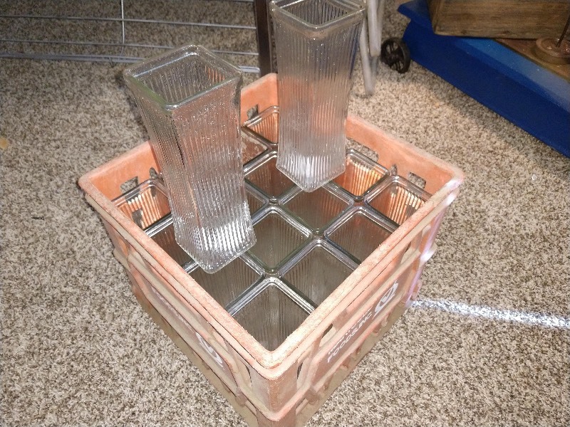 lot 30 image: Antique Square Glass Centerpiece Vases (18) with Off Red Marigold Foods, Inc. Crate