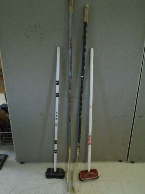 Hockey Sticks and Curling Brooms