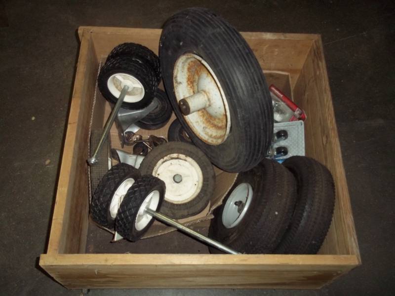 lot 23 image: Crate of Lawn Mower and Wheel Barrow Wheels