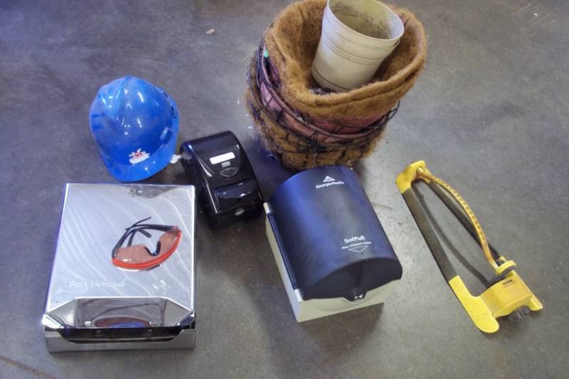 lot 123 image: Hanging baskets, paper towel dispensers, soap dispenser, hard hat and sprinkler