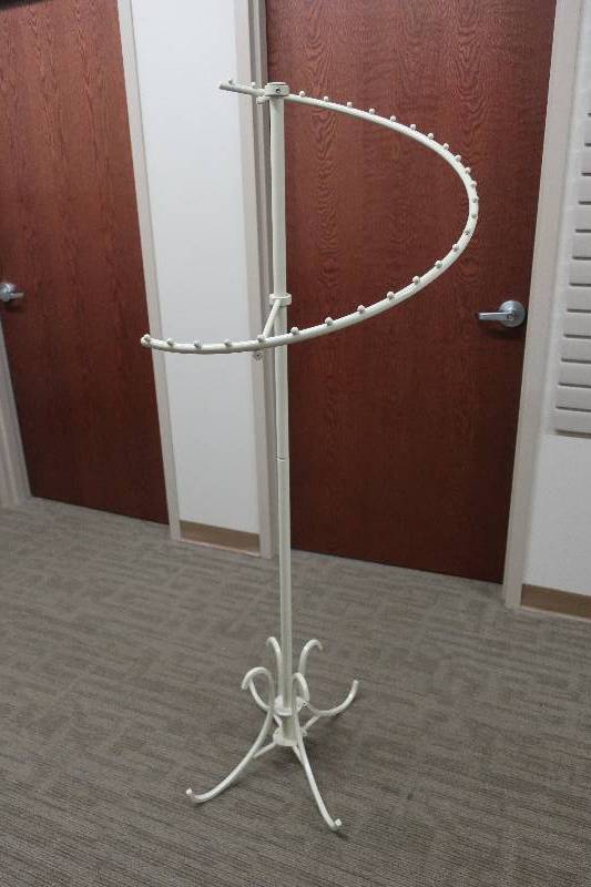 lot 115 image: CURVED CLOTHING RACK