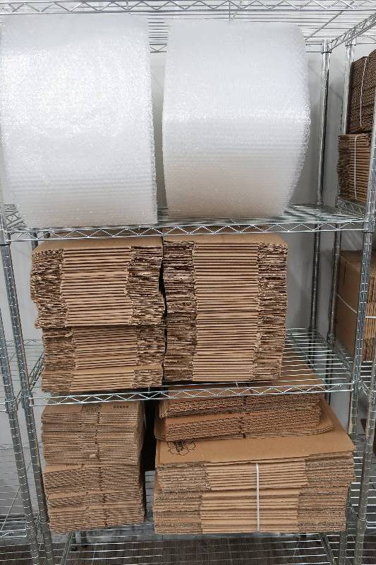 lot 525 image: CONTENTS OF 3 SHELVES OF PACKING SUPPLIES, BUBBLE WRAP AND BOXES