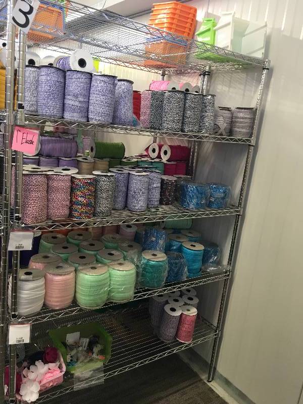 lot 6 image: ROLLS OF RIBBON AND ELASTIC
