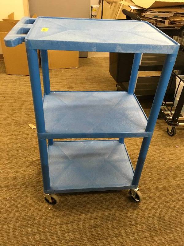 lot 558 image: BLUE PUSH CART AND GARBAGE CANS