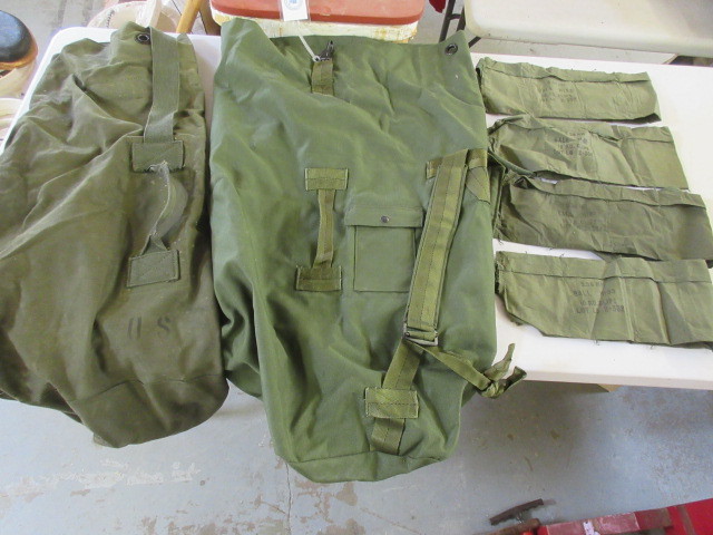 lot 324 image: MILITARY DUFFLE BAGS AND 7 CLIP BANDOLIERS