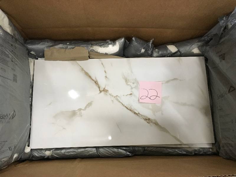 lot 22 image: MSI Carrara 12 in. x 24 in. Glazed Polished Porcelain Floor and Wall Tile (16 sq. ft.  case) New
