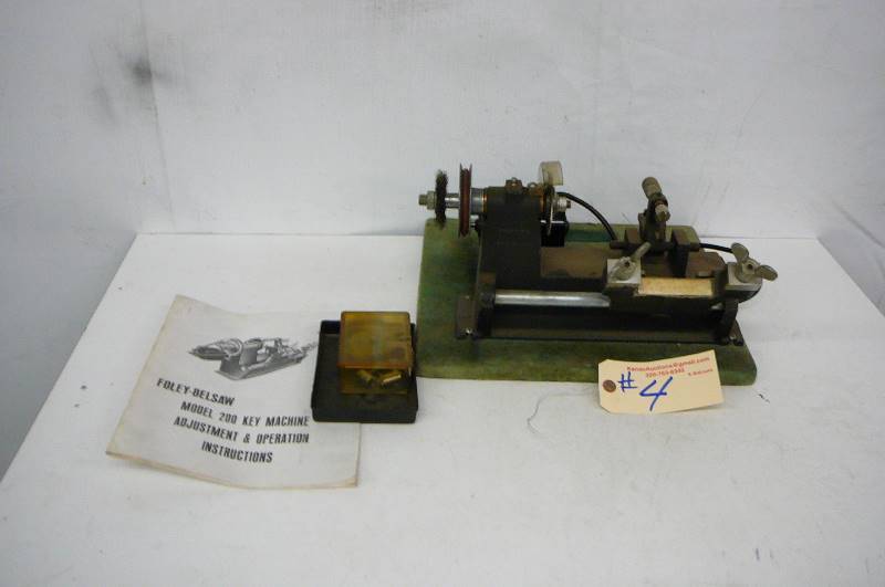 lot 4 image: Foley- Belsaw Model 200 Key Cutting Machine With Book
