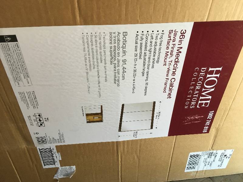 lot 27 image: 36 in Medicine Cabinet Java Finish, Tri-view Framed Surface Mount  open box not used