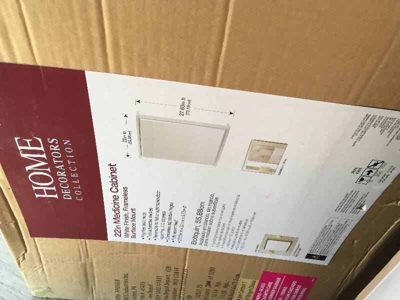 lot 28 image: 22 in Medicine Cabinet White Finish Frameless Surface Mount  open box not used