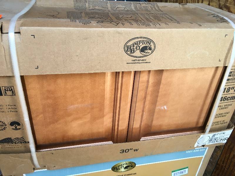 lot 32 image: Hampton Bay Wall Bridge  Cabinet 30 in W x  18 in H x 12 in D Camel Finish  open box not used