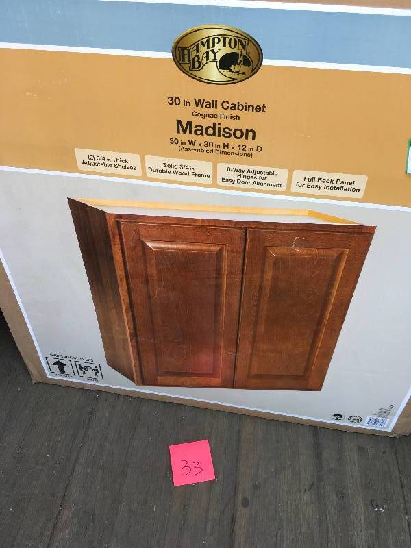 lot 33 image: Hampton Bay 30 in Wall Cabinet Cognac Finish Madison  30 in W x 30 in H x 12 in D  open box not used whit small damage