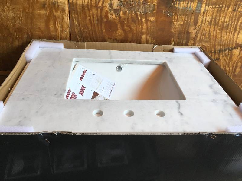 lot 35 image: 31 in. Marble Single Basin Vanity Top in Arabescato Venato Vanity Top Natural marble in polished white finish damage please review the pictures