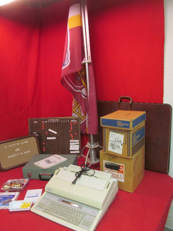 Benson Braves flag, Kwik knobs, typewriter, case of paper, Portfolio, menu boards