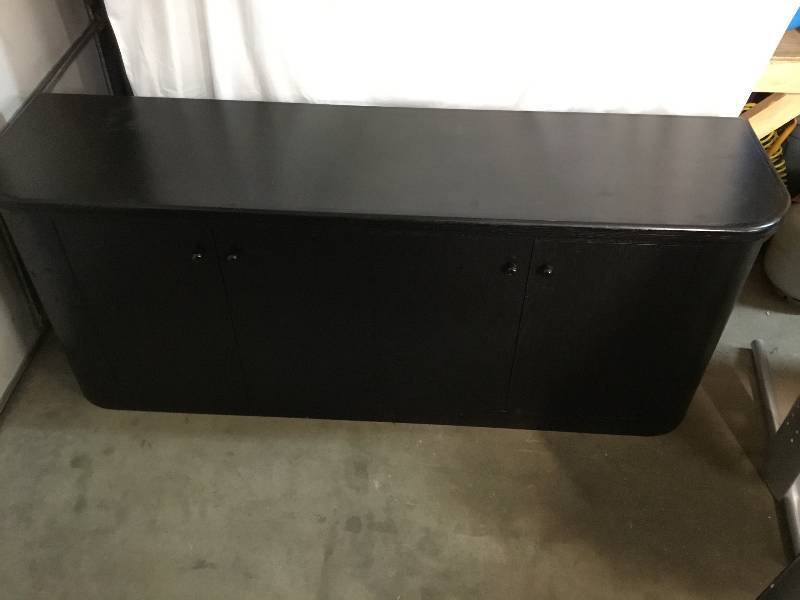 lot 14 image: Large Black Credenza with doors and adjustable shelves.