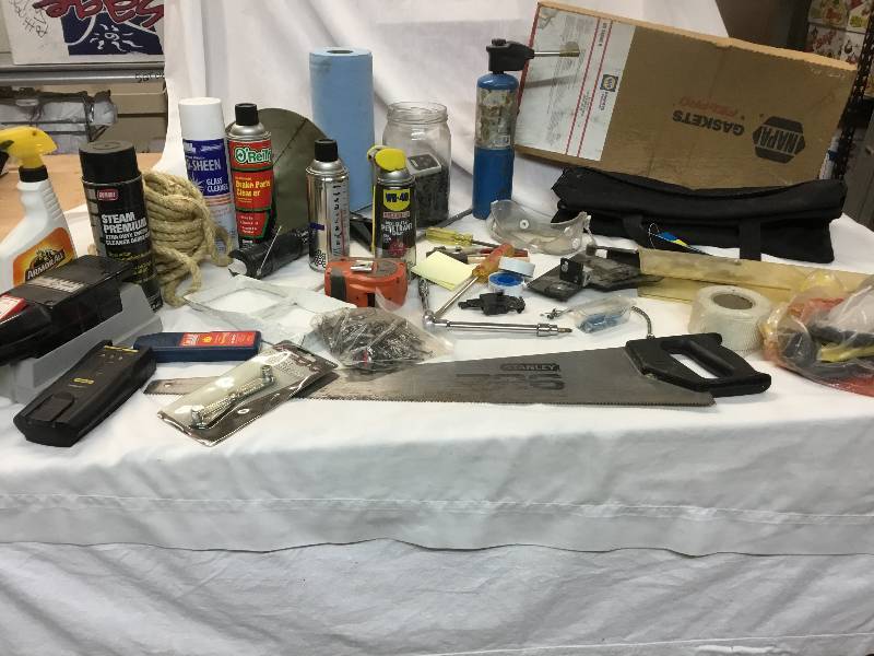 lot 56 image: Garage Items - WD-40, Rope, Saw, Canvas Tool Bag, Screws and Nails, Funnel, Torch