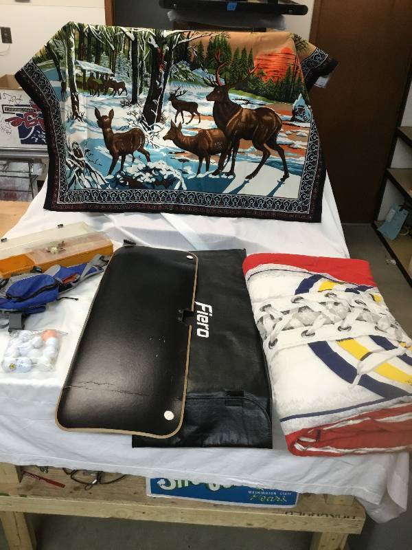lot 57 image: Converse Sneaker Sleeping Bag, Elk Tapestry, Hiking Pack, Golf Ball, Fishing Items