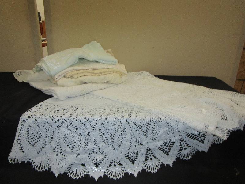 lot 28 image: Large Plastic Lace Table Cloth and More Table Clothes