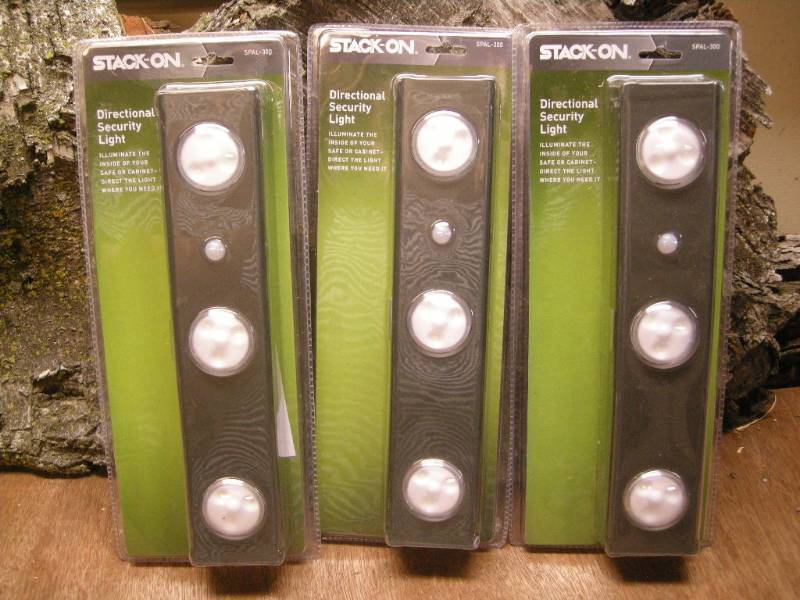lot 107 image: 3 Stack-On Directional Security Lights