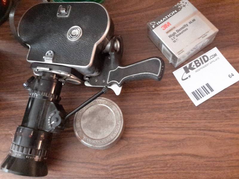 lot 64 image: Old Paillard Bolex Filming Camera, Kodak Company Tin, and Floopy Disks