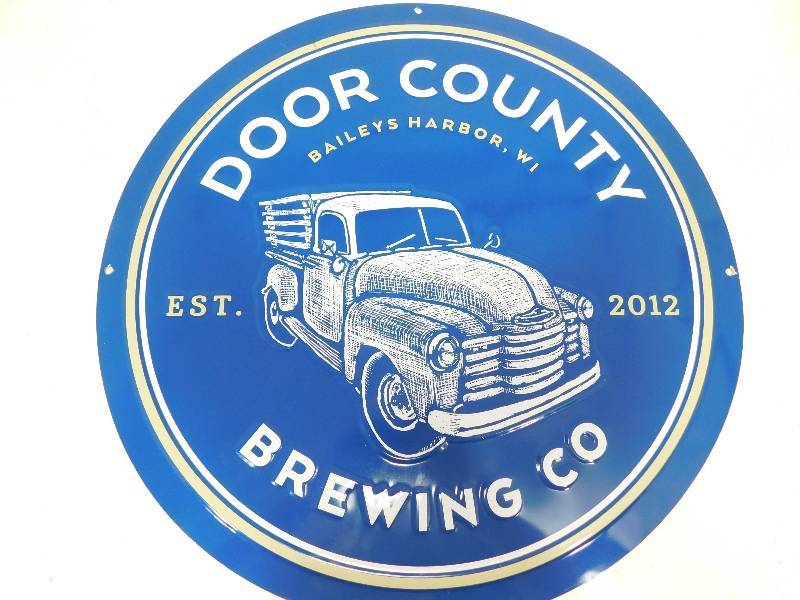 lot 49 image: Metal Round Door County Brewing Co. Sign