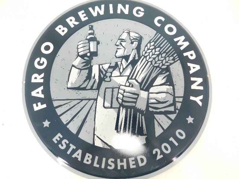 lot 50 image: Metal Round Fargo Brewing Company Sign