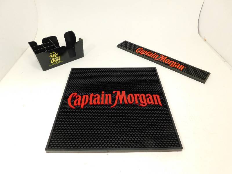 lot 57 image: Captain Morgan Counter and Bar Rail Mats and Napkins, Straws, Coasters Holder